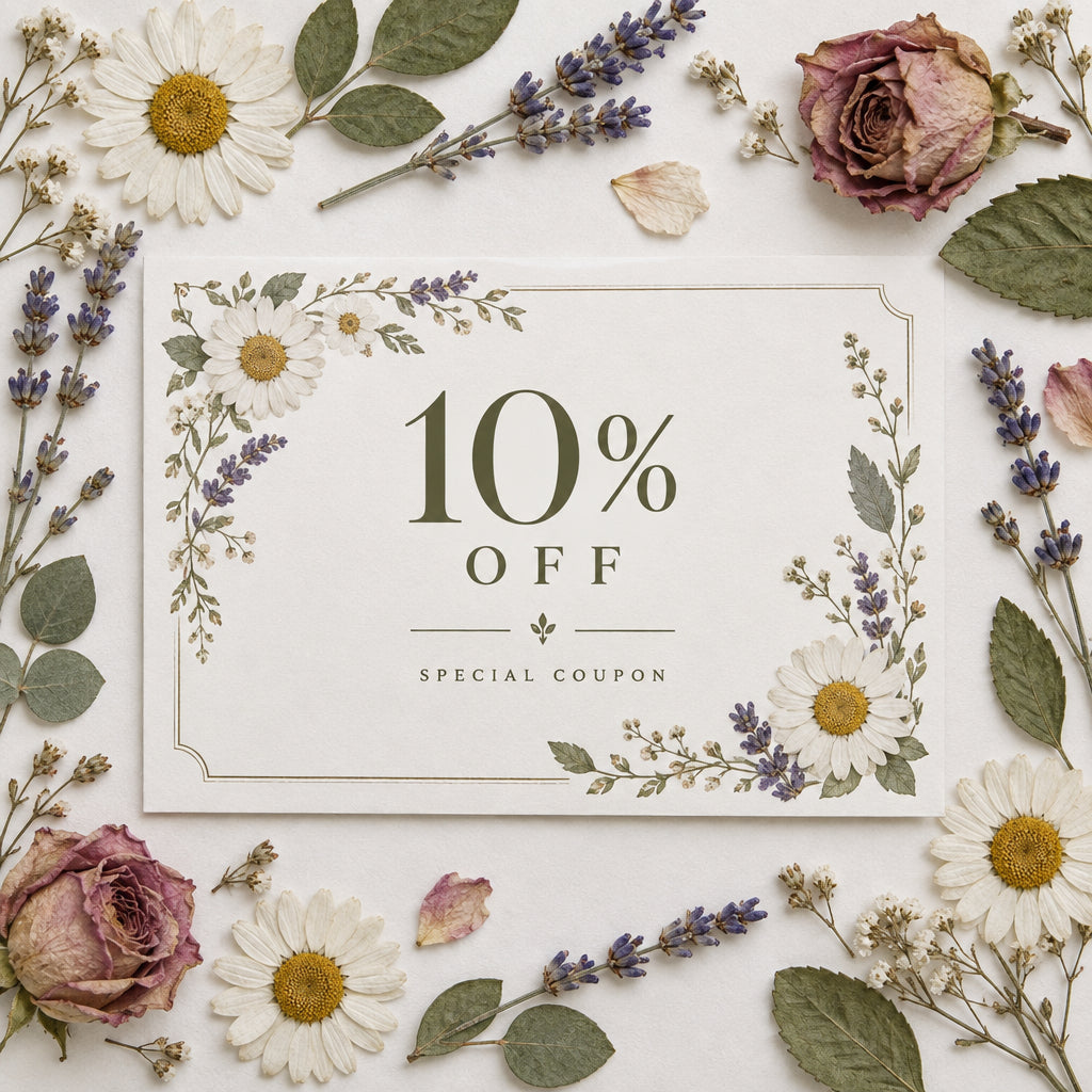 a coupon for 10% off surrounded by pressed flowers